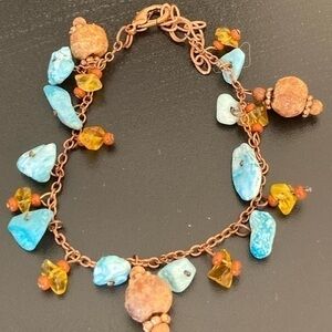 Turquoise and orange colored bracelet.